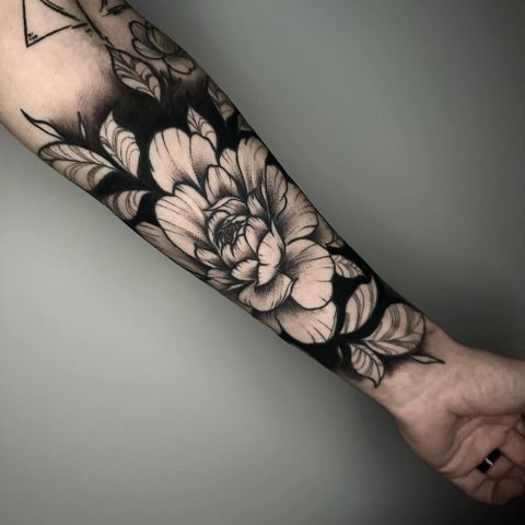 Negative Space Blackout Tattoo