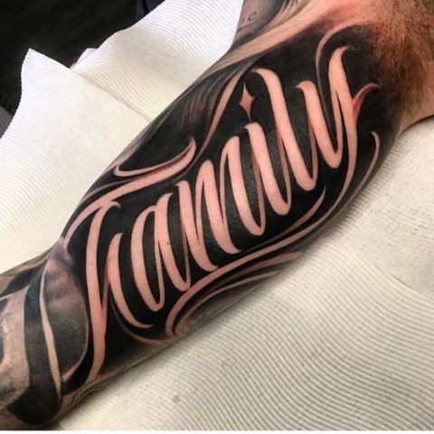 Negative Space Lettering Tattoo