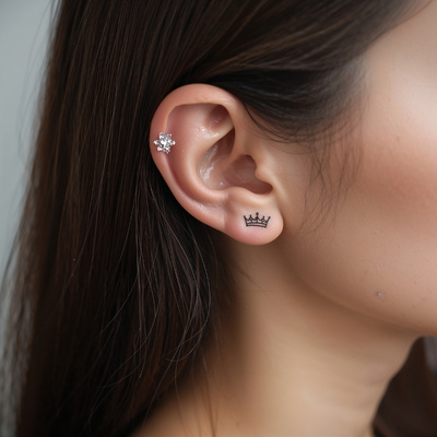 Simple and Elegant Crown Tattoo Behind the Ear